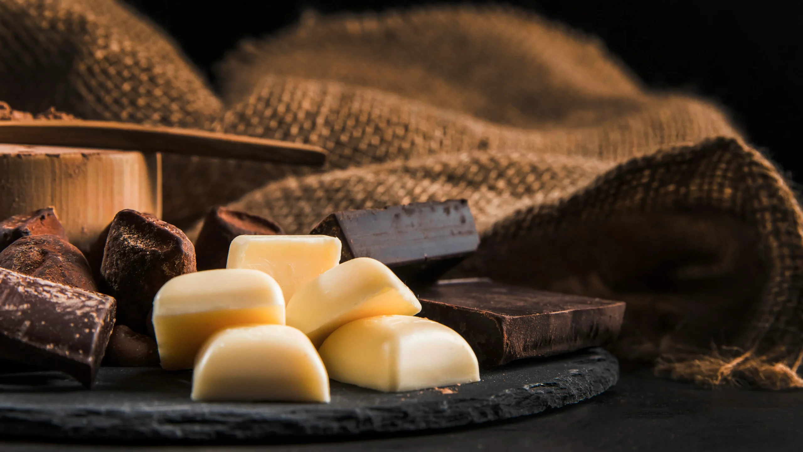 Cocoa butter offers a smooth texture and a soothing chocolate scent, enhancing skin's natural moisture barrier with its rich, protective qualities.